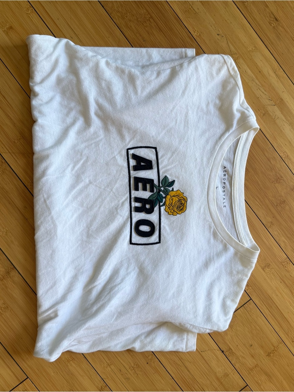 Aeropostale White Tee with Black AERO Logo and Yellow Rose